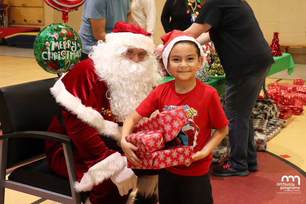 Santa Giving Gifts to an Upper School Students