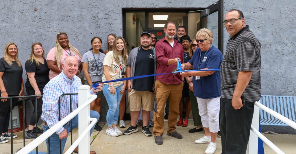 Lower School Principal John Petsch (center) and Executive Director, Education, Susan Lafferty (right), cut the ribbon on the new Archway Learning Center. George Richards, CEO and CFO (left), and Vice President and COO Shawn Gibson (far right), were also in attendance.